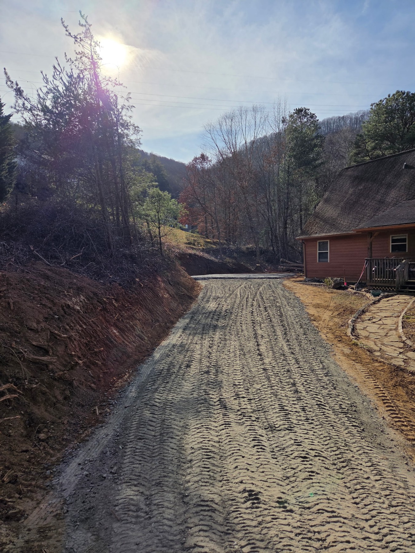 Cutting a new road into mountain property by Cress Construction